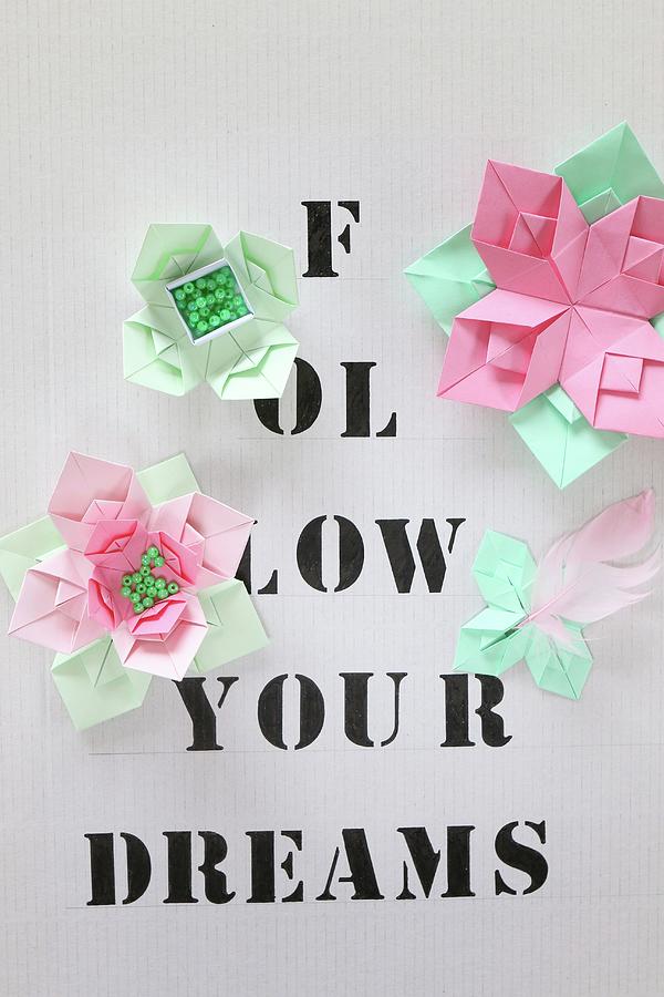 Origami Flowers On Paper Printed With Lettering #1 Photograph by Regina Hippel