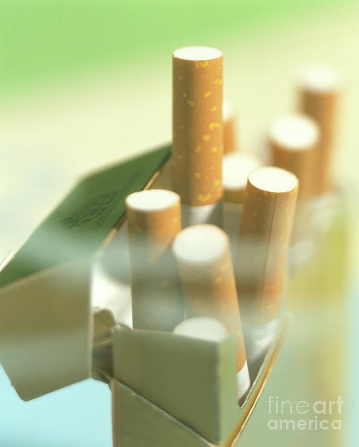Packet Of Cigarettes Seen Through A Haze Of Smoke #1 Photograph by Sheila Terry/science Photo Library