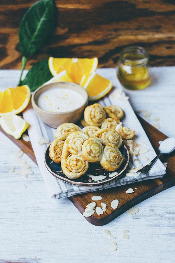Palmier Pastries With Almond Flakes And Orange Cream #1 Photograph by Kai Mitt
