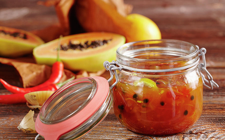 Papaya And Orange Chutney With Curry And Hot Peppers In A Jar #1 Photograph by Teubner Foodfoto