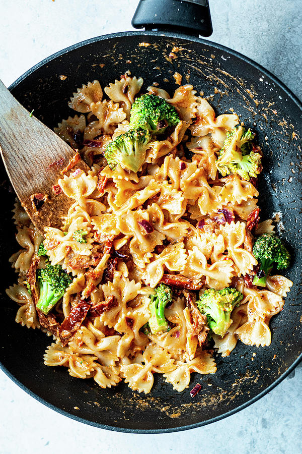 Pasta With Broccoli, Pesto Cream Sauce And Sun-dried Tomatoes #1 Photograph by Simone Neufing