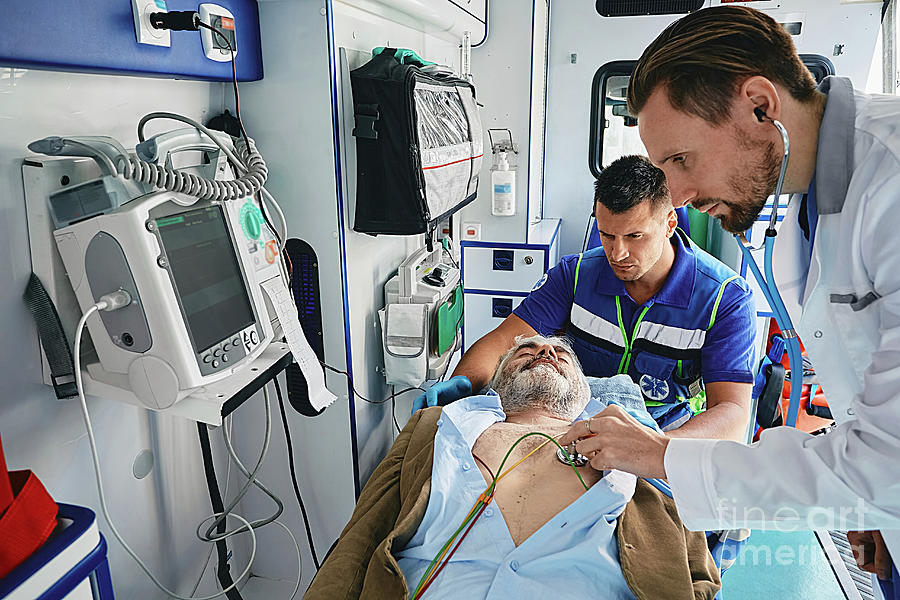 Patient Being Treated In The Back Of An Ambulance Photograph by ...