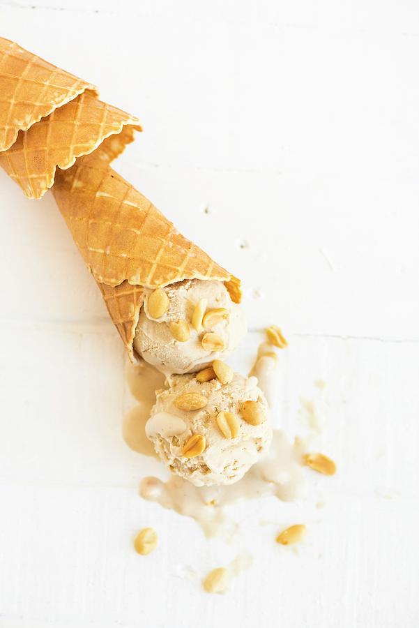 Peanut Butter And Banana Frozen Yoghurt In An Ice Cream Cone #1 Photograph by Hein Van Tonder