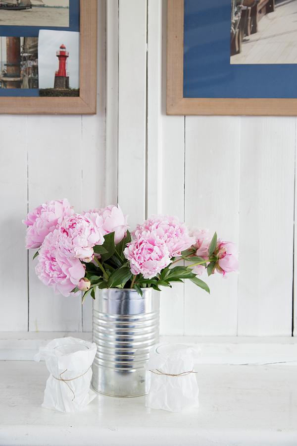 Peonies In Tin Can Against Wooden Wall #1 Photograph by Claudia Timmann