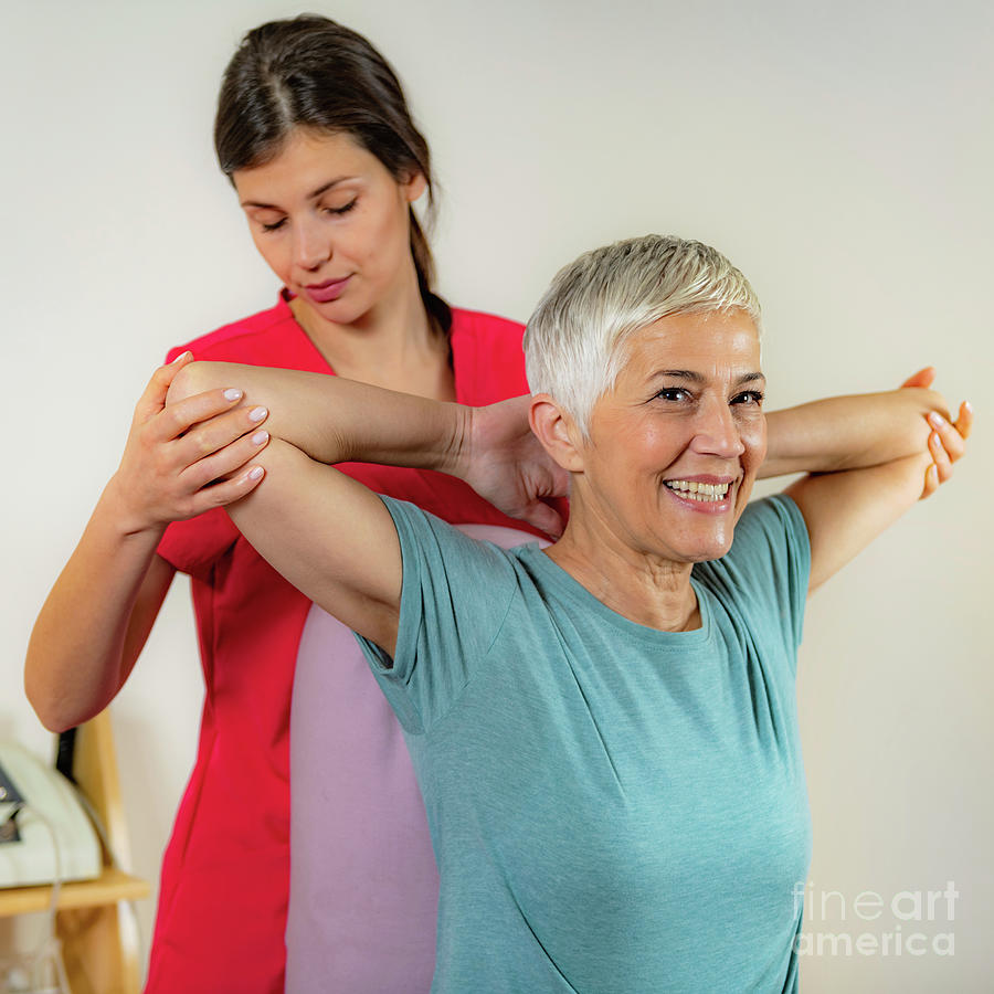 Physical Therapist Examining Patient #1 Photograph by Microgen Images/science Photo Library