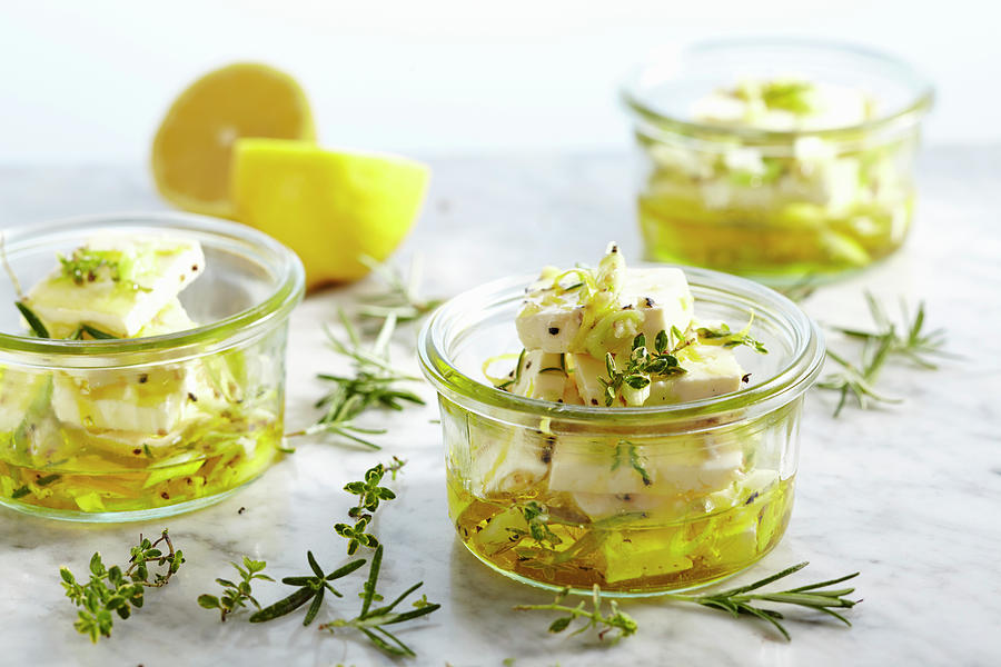 Pickled Feta Cheese In Olive Oil With Garlic, Spring Onions, Thyme, Rosemary And Lemon Pepper #1 Photograph by Teubner Foodfoto
