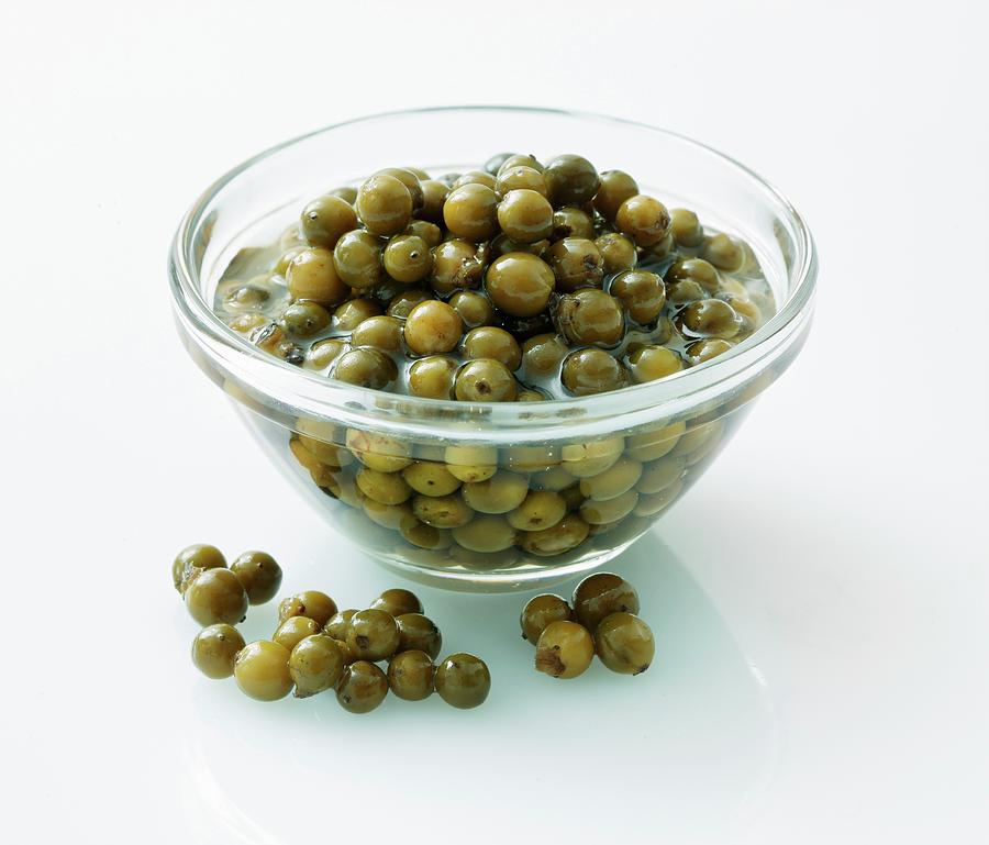 Pickled Green Peppercorns In A Glass Bowl #1 Photograph by Petr Gross