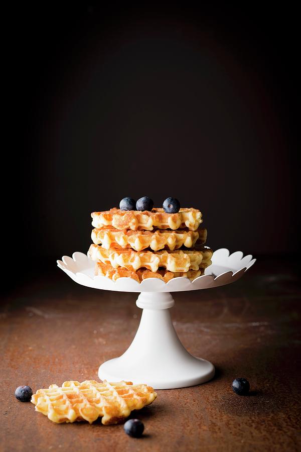 Pile Of Waffles Ligeoises And Blueberries On A Presentation Dish #1 Photograph by Hallet
