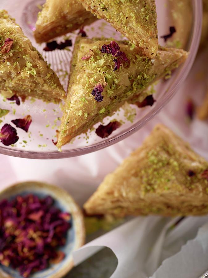 Pistachio Baklava With Rose Petals On Cake Stand With Pink Napkin #1 Photograph by Artfeeder