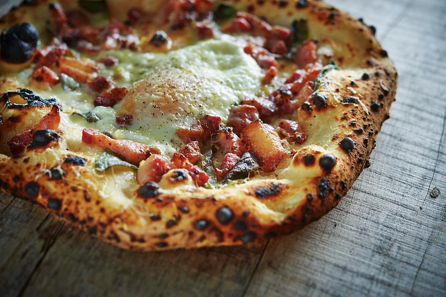 Pizza With Pancetta And A Fried Egg #1 Photograph by Greg Rannells