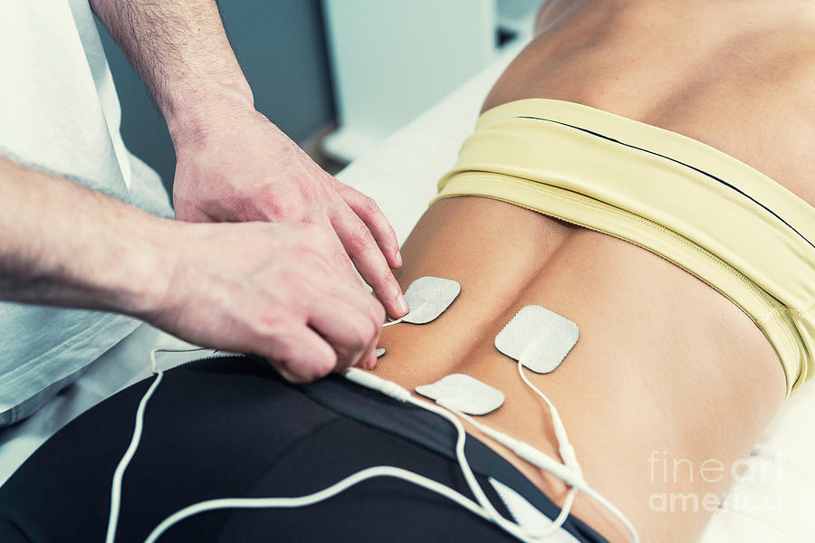 Electrode Photograph - Placing Tens Electrodes On Lower Back #1 by Microgen Images/science Photo Library