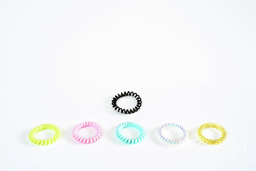 Plastic bracelets of various colors, isolated in a pattern arran by Joaquin Corbalan Plastic bracelets of various colors, isolated in a pattern arran by Joaquin Corbalan