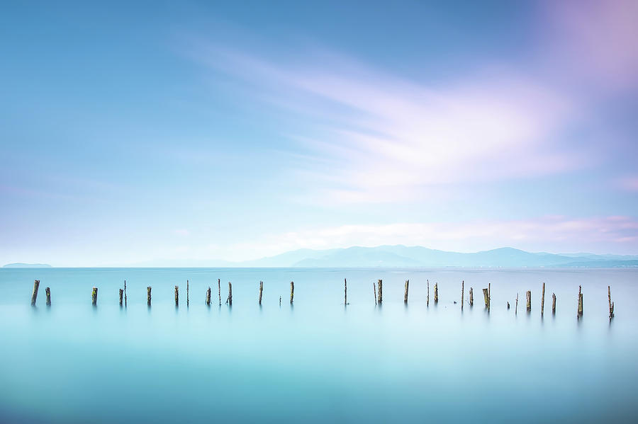 Poles and soft water on sea landscape. Long exposure. #1 Photograph by Stefano Orazzini