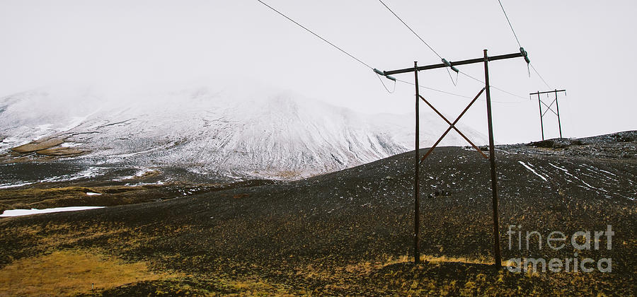 Poles of electricity in the middle of a snowy mountain to supply electrical power to remote villages. #1 Photograph by Joaquin Corbalan