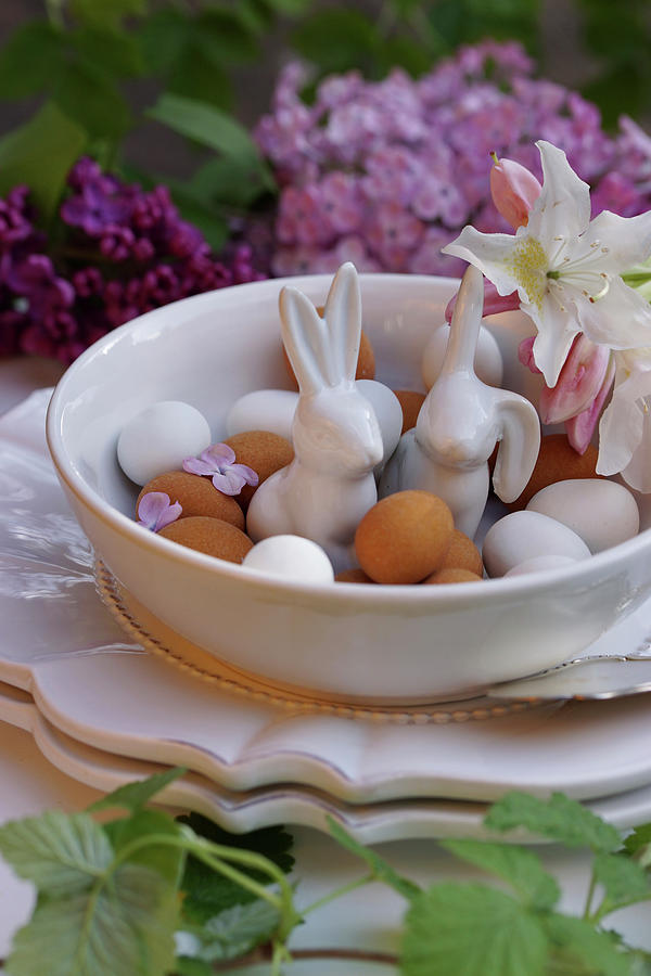Porcelain Easter Bunnies Between Marzipan Eggs In Bowl #1 Photograph by Angelica Linnhoff