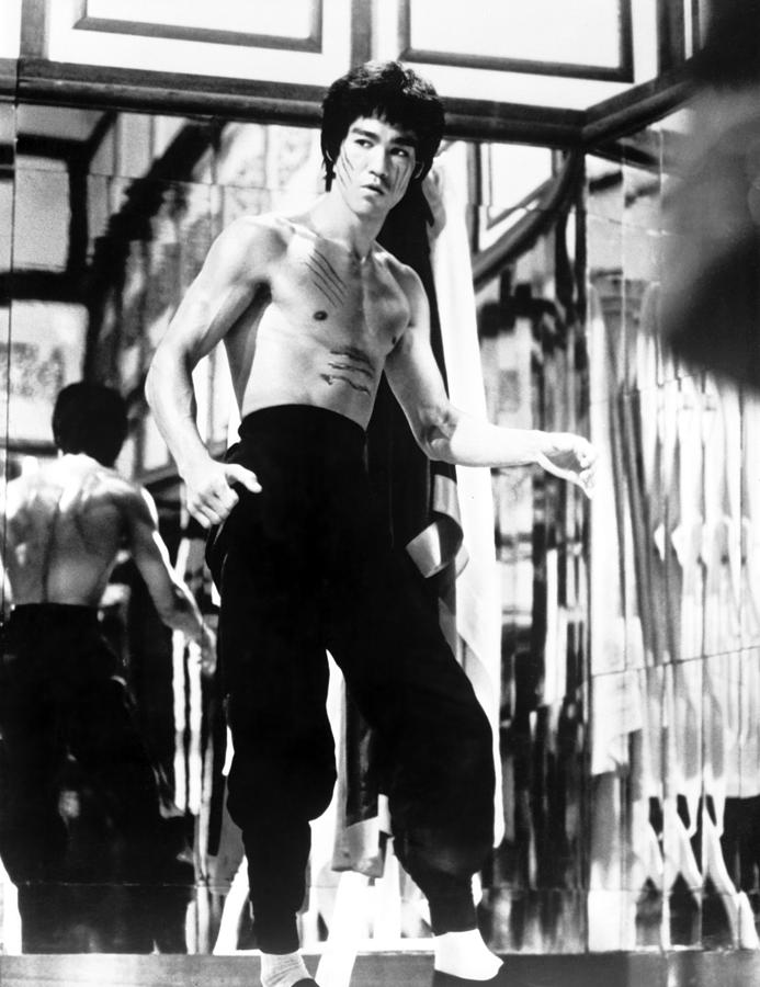 Bruce Lee Photograph - Portrait Of Bruce Lee In A Fight Scene Of Enter The Dragon #1 by Globe Photos