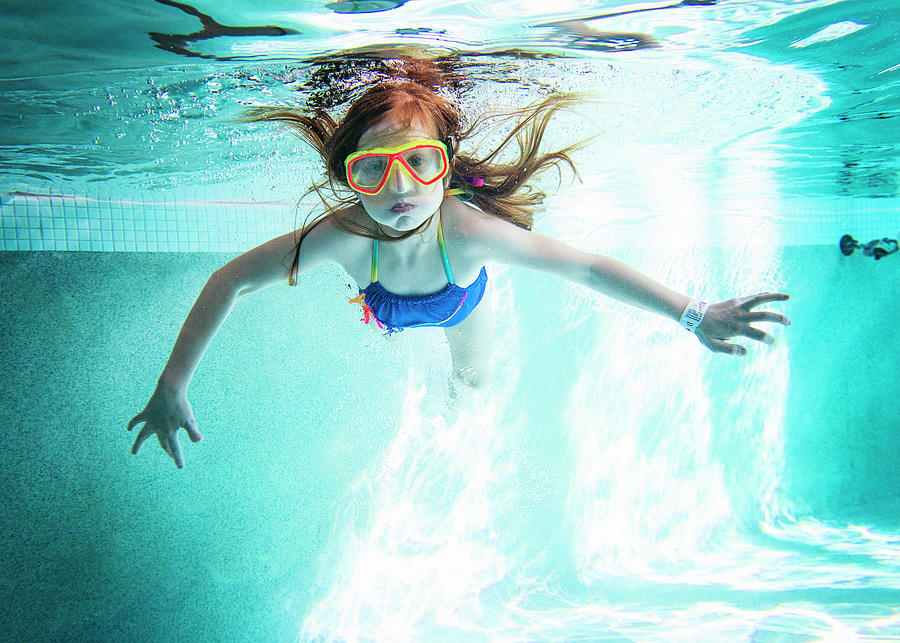 Portrait Of Girl Swimming Underwater In Pool Photograph by Cavan Images ...