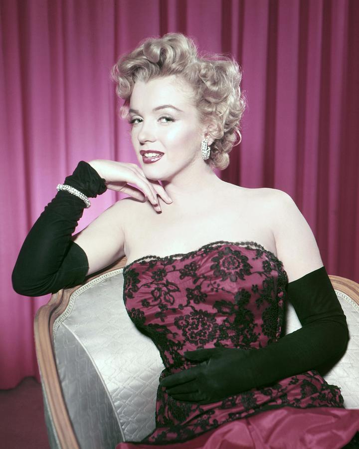 Portrait Of Marilyn Monroe Sitting On Chair Photograph by Globe Photos ...