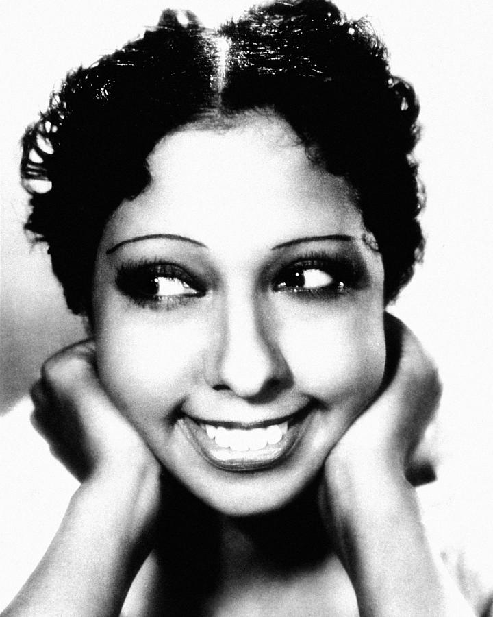 Black And White Photograph - Portrait Of Smiling Josephine Baker #1 by Globe Photos
