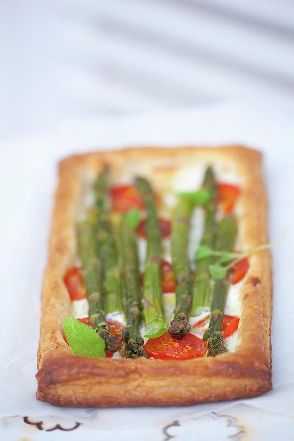 Puff Pastry Tart With Goats Cheese, Tomatoes And Asparagus #1 Photograph by Studio Lipov
