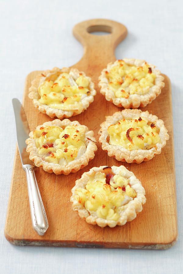 Puff Pastry Tartlets With Camembert And Potato Mash #1 Photograph by Castilho, Rua