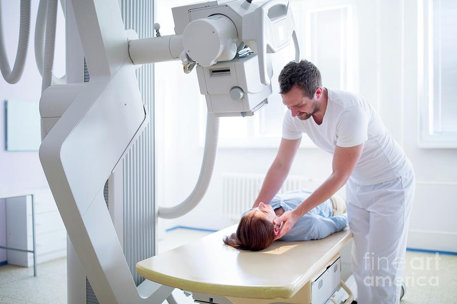 Radiologist Positioning Patient For X-ray Photograph by Science Photo ...