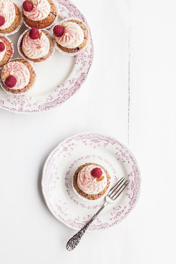 Raspberry And Almond Muffins Decorated With Buttercream And Dried Raspberry Powder #1 Photograph by Sarah Coghill
