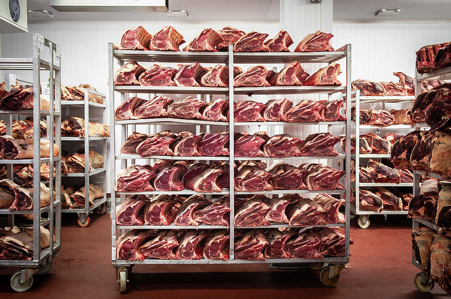 Raw Meat On Shelves In A Slaughter House #1 Photograph by Rob Whitrow