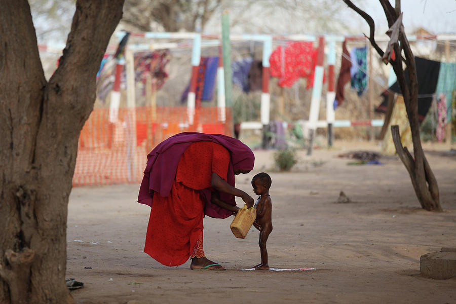 Refugees Flock To Dadaab As Famine Photograph by Oli Scarff Refugees Flock To Dadaab As Famine Photograph by Oli Scarff