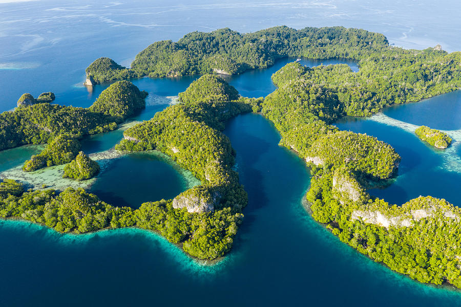 Remote Limestone Islands In Raja Ampat Photograph by Ethan Daniels ...