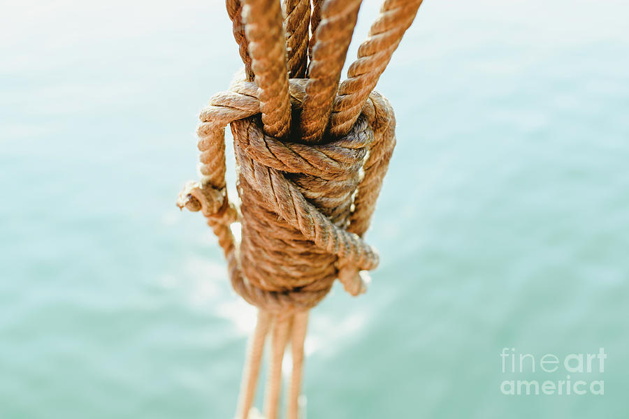 Rigging and ropes on an old sailing ship to sail in summer. #1 Photograph by Joaquin Corbalan