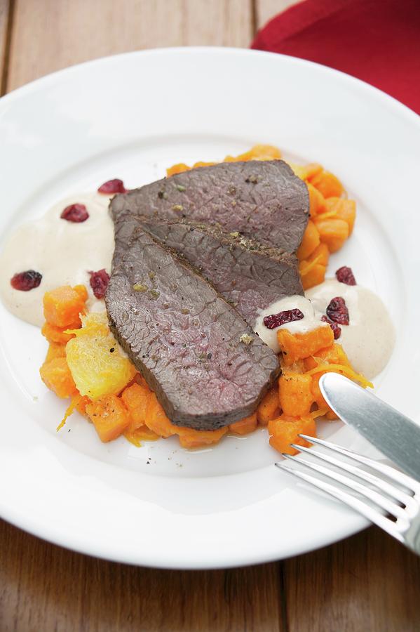 Roasted Leg Of Venison With Cranberry Hollandaise And Sweet Potatoes Cooked With Orange #1 Photograph by Food Experts Group