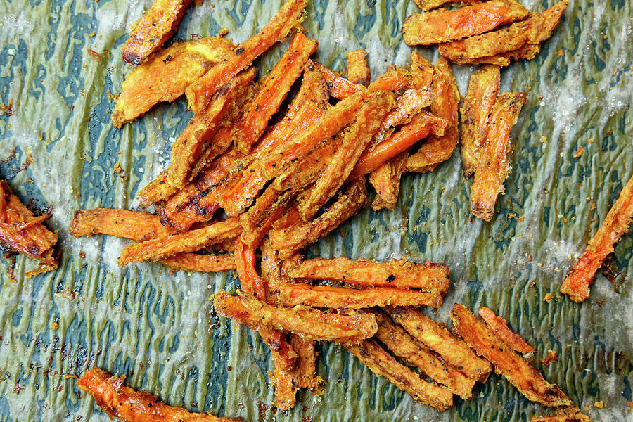 Roasted Sweet Potato Strips With A Curry Crust #1 Photograph by Petr Gross