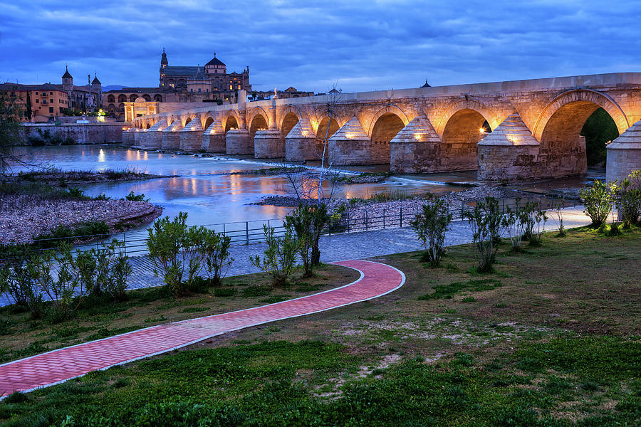 Roman Bridge on Guadalquivir River in Cordoba #1 Photograph by Artur Bogacki