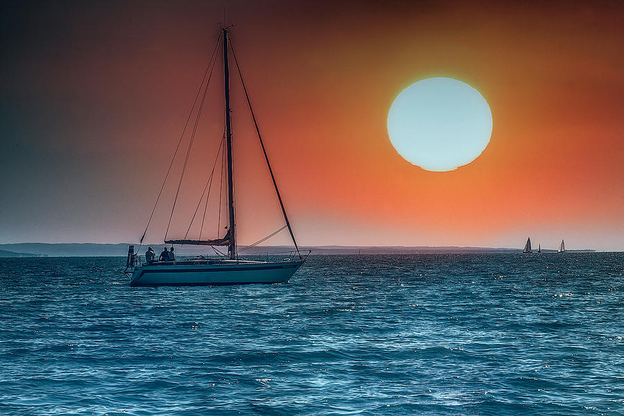 Sailing into the sunset #1 Photograph by Wolfgang Stocker
