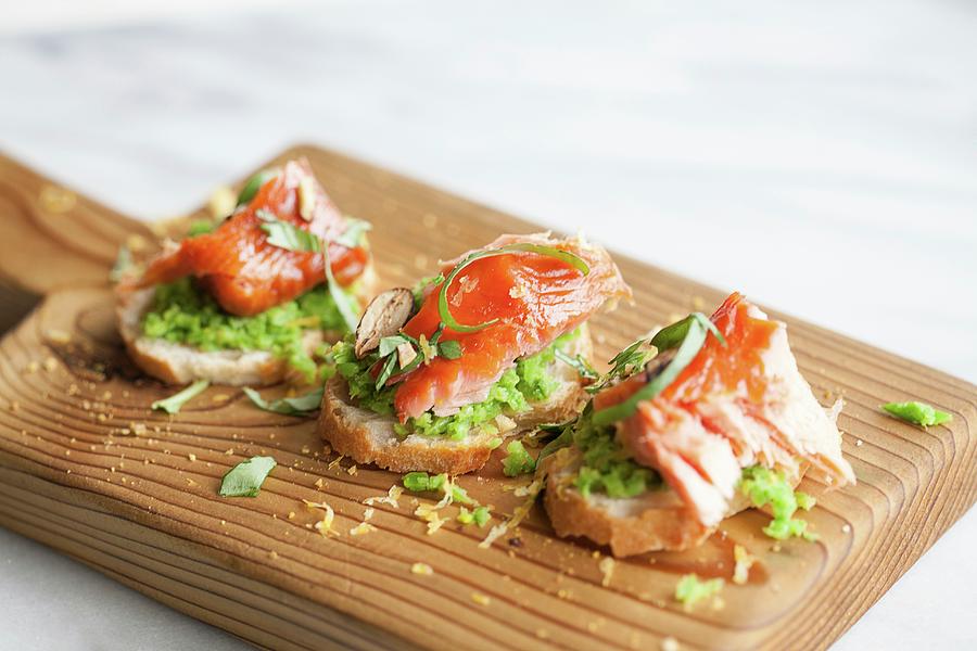 Salmon Crostini With Mashed Peas #1 Photograph by Annie Kuster