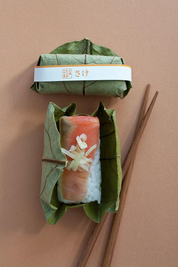 Salmon Sushi With Ginger Strips Wrapped In A Leaf #1 Photograph by Martina Schindler