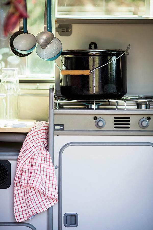 Saucepan On Gas Cooker In Camper Van #1 Photograph by Eising Studio