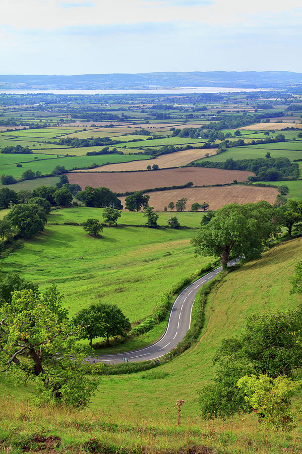 Scenic Cotswolds - Patchwork fields, winding road #1 Photograph by Seeables Visual Arts