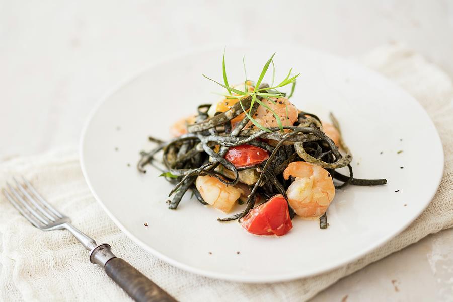 Seaweed Pasta With Prawns And Cherry Tomatoes #1 Photograph by Jan Wischnewski
