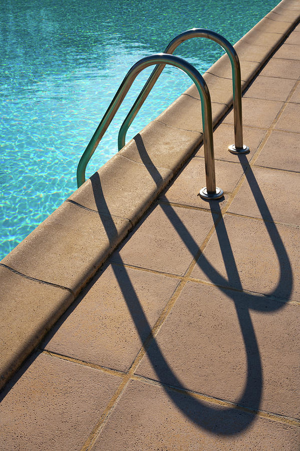 Semi-abstract swimming pool ladder shadows #1 Photograph by Seeables Visual Arts