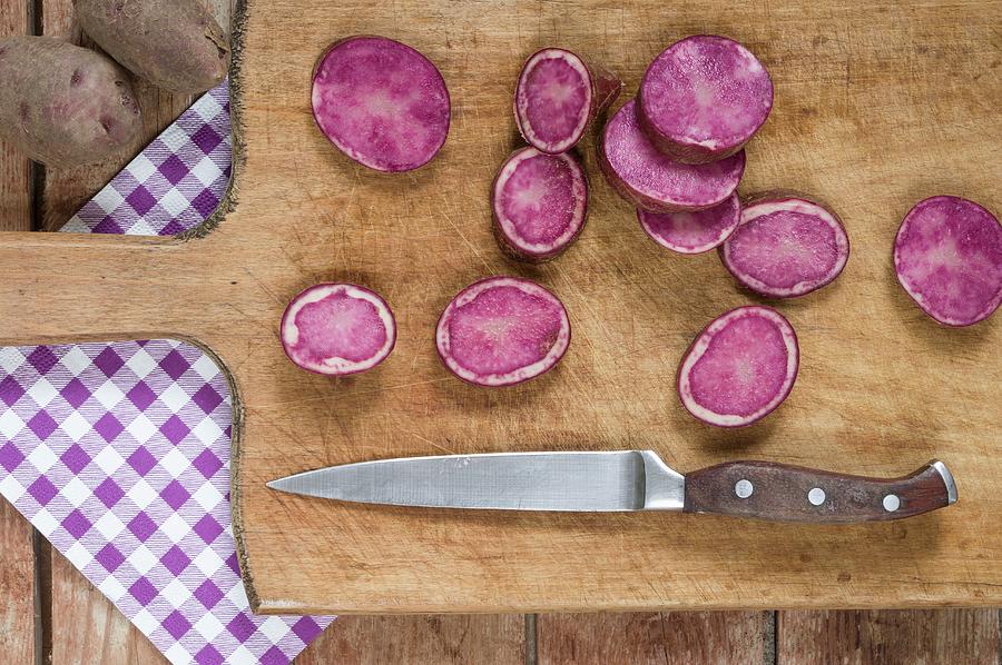 Sliced Purple Potatoes On A Wooden Board #1 Photograph by Dr. Karen Meyer-rebentisch