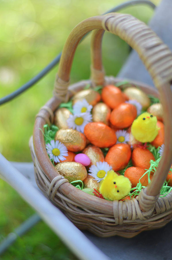 Small Basket Of Easter Eggs Outdoors #1 Photograph by Keroudan