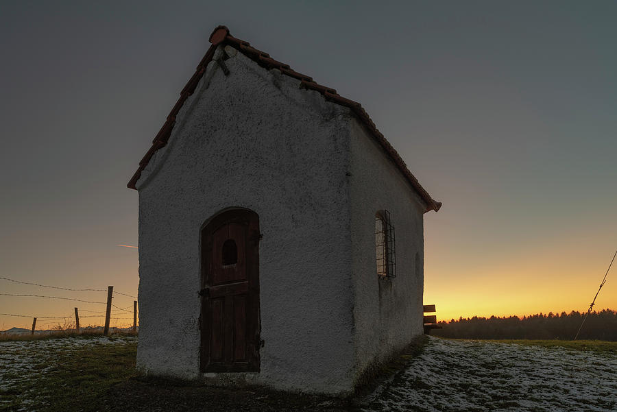 Small Chapel Next To A Large Tree In Backlight In The Evening. Seehausen, Starberger See, Bavaria, Germany #1 Photograph by Christoph Olesinski