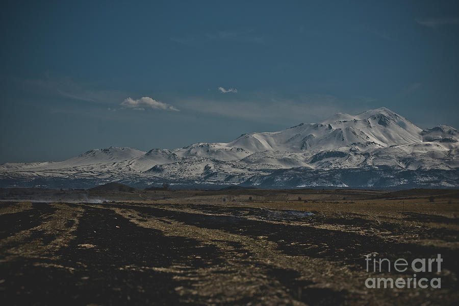 Snow-covered mountains in the Turkish region of Capaddocia. #1 Photograph by Joaquin Corbalan