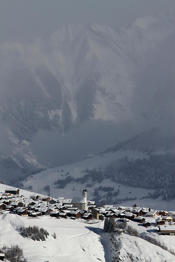 Snowy Village With Mountain Range And #1 Photograph by Gerhard Fitzthum