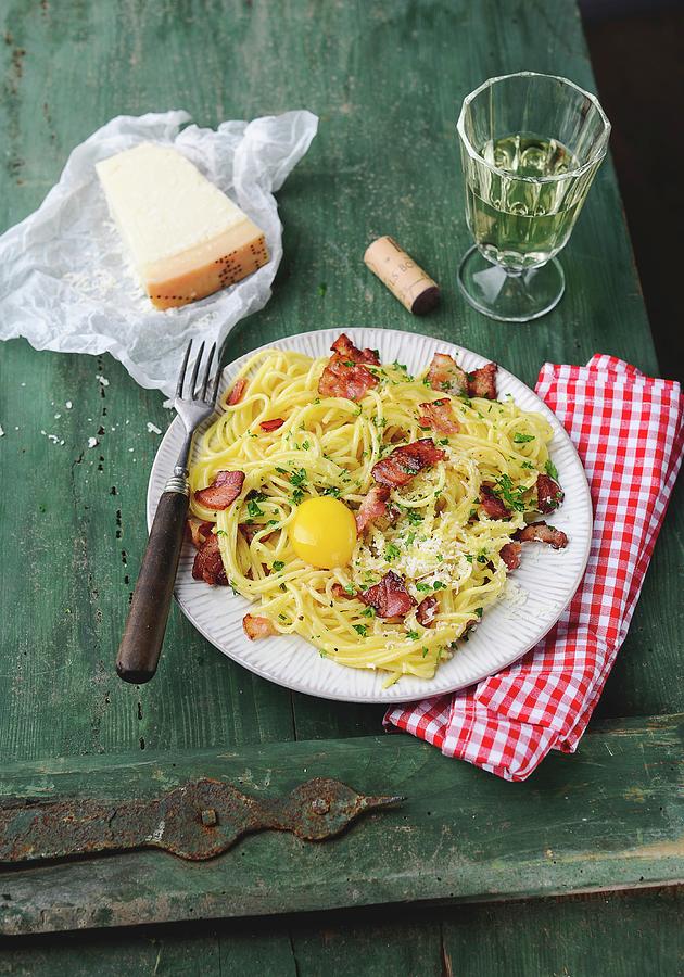 Spaghetti Carbonara With Ham And Egg Yolk #1 Photograph by Ewgenija Schall