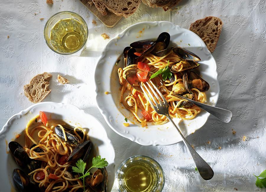 Spaghetti With Mussels, White Wine And Bread seen From Above #1 Photograph by Ludger Rose