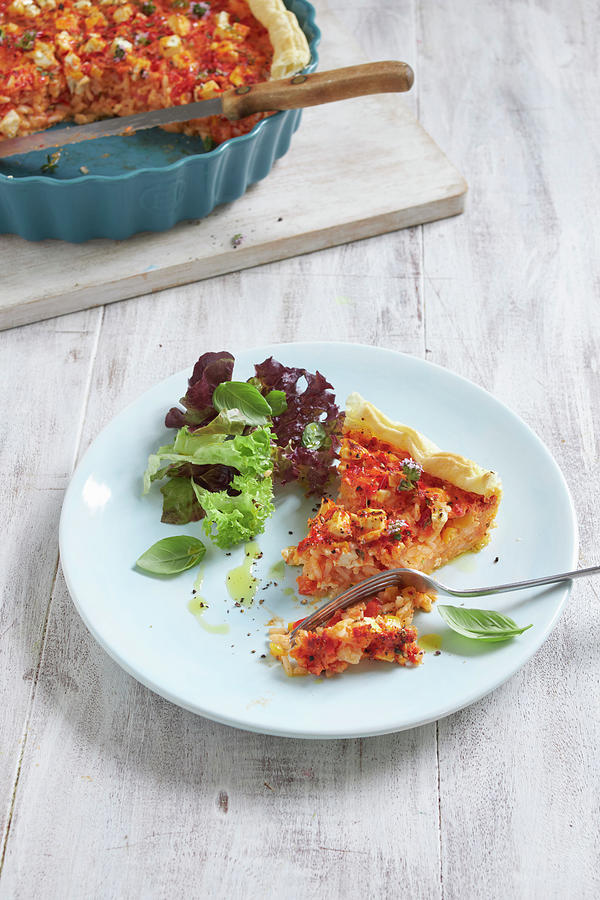 Spicy Rice Quiche With Cheese On A Plate And In A Pie Dish #1 Photograph by Oliver Stockfood Studios / Brachat
