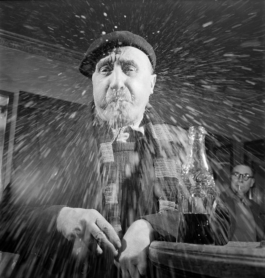 Black And White Photograph - Spitting Man #1 by Mark Kauffman